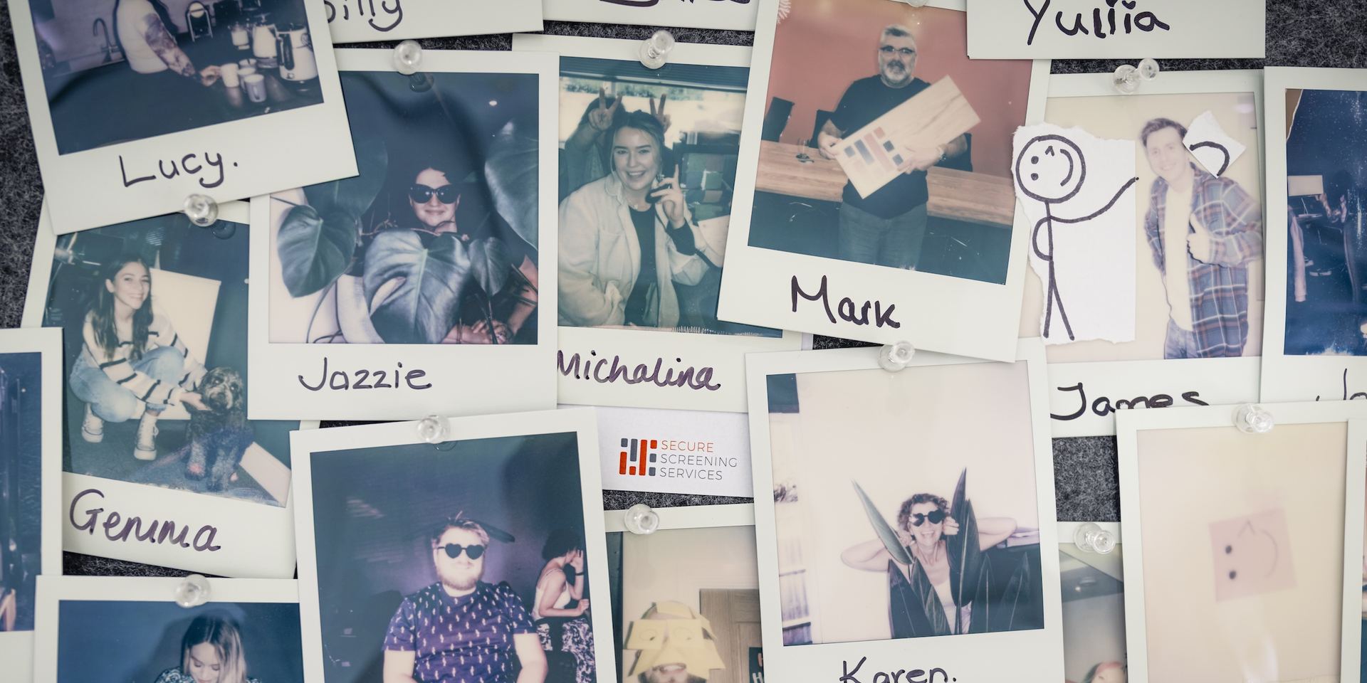 Photos of our staff on a pin board