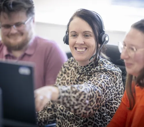 Screening team members working together at a computer
